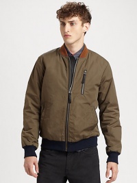 Beat the season's elements in style with this jersey-lined nylon jacket with contrast collar and hem and leather detail.Zip frontZippered chest, waist slash pocketsRibbed knit cuffs and hemAbout 27 from shoulder to hem62% nylon/38% cottonDry cleanImported Beat the season's elements in style with this jersey-lined nylon jacket with contrast collar and hem and leather detail.Zip frontZippered chest, waist slash pocketsRibbed knit cuffs and hemAbout 27 from shoulder to hem62% nylon/38% cottonDry cleanImported