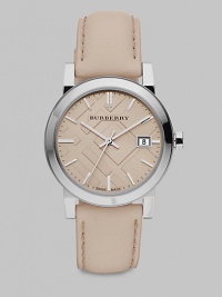 An iconic check stamped dial with a sleek stainless steel case and a supple leather strap. Swiss quartz movementWater resistant to 5 ATMRound stainless steel case, 34mm (1.3)Smooth bezelTrench check stamped dialBar hour markersDate display at 3 o'clockSecond hand Trench leather strapMade in Switzerland An iconic check stamped dial with a sleek stainless steel case and a supple leather strap. Swiss quartz movementWater resistant to 5 ATMRound stainless steel case, 34mm (1.3)Smooth bezelTrench check stamped dialBar hour markersDate display at 3 o'clockSecond hand Trench leather strapMade in Switzerland