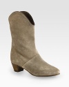 Rich leather trim finishes this western-inspired shape of fine suede. Stacked heel, 1¾ (45mm)Shaft, 9¾Leg circumference, 12Suede upper with leather trimLeather liningLeather and rubber solePadded insoleImportedOUR FIT MODEL RECOMMENDS ordering one half size up as this style runs small. 