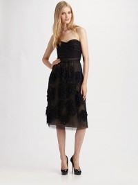 The sweet strapless style is adorned with floral appliqués and cinched at the waist with a ribbon.Strapless sweetheart neckline Pleated bodice Appliqués on skirt Concealed side zip Fully lined About 32 from natural waist Polyester Dry clean Imported The sweet strapless style is adorned with floral appliqués and cinched at the waist with a ribbon.Strapless sweetheart neckline Pleated bodice Appliqués on skirt Concealed side zip Fully lined About 32 from natural waist Polyester Dry clean Imported