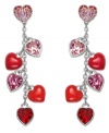 Make every day Valentine's Day! Swarovski's stunning Roxanne earrings feature cascading hearts in sweet tones of light siam and rose crystal. The dangling elements can be removed to reveal a delicate pair of heart-shaped studs in crystal pave. Set in silver tone mixed metal. Approximate drop: 1-5/8 inches.