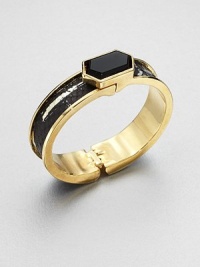 A goldtone cuff accented in luxurious python inlay with a hexagonal black onyx stone. Black onyxGoldtonePythonDiameter, about 2Hinged closureMade in USA A goldtone cuff accented in luxurious python inlay with a hexagonal black onyx stone. Black onyxGoldtonePythonDiameter, about 2Hinged closureMade in USA
