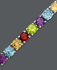 A rainbow of gemstones makes any day brighter. Get swept away with alternating round-cut blue topaz (4-1/2 ct. t.w.), amethyst (2-3/4 ct. t.w.), citrine (3-1/2 ct. t.w.), garnet (3-5/8 ct. t.w.) and peridot (3-3/4 ct. t.w.). Bracelet crafted in sterling silver. Approximate length: 7 inches.