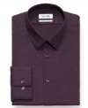Sharp and simple-this Calvin Klein patterned shirt touts a slim fit and no-iron material for style that can't go wrong.