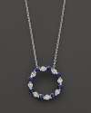 Diamond and sapphire circle pendant in 14K white gold.