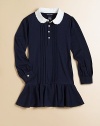 A comfortable pintuck dress in soft stretch cotton jersey is finished with ruffle details and a contrast collar for a pretty look.Peter Pan collarLong sleeves with barrel cuffsButton-frontRuffled hemCottonMachine washImported