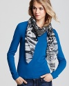 Click your heels three times for this eye-catching Aqua scarf, covered with tornado-like swirls of animal print.