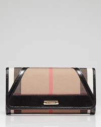 Keep your cash (and card) cache organized with Burberry's check wallet. Take the plaid package into after hours--it doubles as a preppy chic clutch with a black sheath and kitten heels.