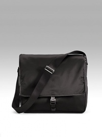 Sturdy nylon with single clip closure and adjustable shoulder strap. Front zip pocket under flap Back zip pocket Inside zip pocket Jacquard lining 14W X 12H X 4D Made in Italy Sturdy nylon with single clip closure and adjustable shoulder strap. Front zip pocket under flap Back zip pocket Inside zip pocket Jacquard lining 14W X 12H X 4D Made in Italy