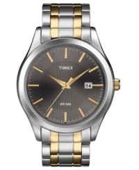 A handsome timepiece from Timex built for style and functionality, with structured steel and golden tones. A handsome timepiece from Timex built for style and functionality, with structured steel and golden tones.