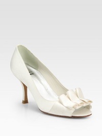Chic satin elegance distinguished by a hand-ruched bow and pretty peep-toe silhouette. Self-covered heel, 2½ (65mm)Satin upperLeather lining and solePadded insoleImported Chic satin elegance distinguished by a hand-ruched bow and pretty peep-toe silhouette. Self-covered heel, 2½ (65mm)Satin upperLeather lining and solePadded insoleImported