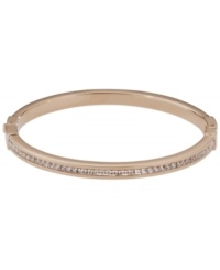 Style meant for stacking. This must-have design by Michael Kors combines a thin, stackable bangle with pave-set glass accents. Set in rose gold tone mixed metal. Approximate diameter: 2-1/2 inches. Style meant for stacking. This must-have design by Michael Kors combines a thin, stackable bangle with pave-set glass accents. Set in rose gold tone mixed metal. Approximate diameter: 2-1/2 inches.