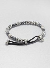 From the Brilliance Collection. A mix of silvery beads includes faceted hematite, smooth stainless steel and rhinestone-crusted spheres, strung on a stretchy strand with a leather slide close.HematiteGlassSilvertone and stainless steelLeatherDiameter, about 2.25Imported From the Brilliance Collection. A mix of silvery beads includes faceted hematite, smooth stainless steel and rhinestone-crusted spheres, strung on a stretchy strand with a leather slide close.HematiteGlassSilvertone and stainless steelLeatherDiameter, about 2.25Imported