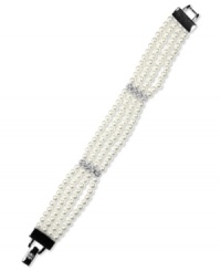 Classic enchantment. This elegant pearl bracelet from Givenchy features four strands of pearls with two bands of round-cut crystals. Measures 7-1/2 inches. Classic enchantment. This elegant pearl bracelet from Givenchy features four strands of pearls with two bands of round-cut crystals. Measures 7-1/2 inches.
