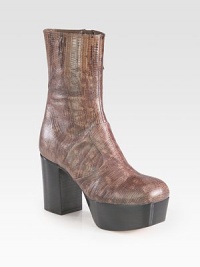 Add some exotic flair with this reptile-embossed leather silhouette on a tall stacked platform and heel. Stacked heel, 3¾ (95mm)Stacked platform, 1¾ (45mm)Compares to a 2 heel (50mm)Embossed leather upperSide zipLeather lining and solePadded insoleMade in ItalyThis style runs small. We recommend ordering one half size up for a standard fit. Add some exotic flair with this reptile-embossed leather silhouette on a tall stacked platform and heel. Stacked heel, 3¾ (95mm)Stacked platform, 1¾ (45mm)Compares to a 2 heel (50mm)Embossed leather upperSide zipLeather lining and solePadded insoleMade in ItalyThis style runs small. We recommend ordering one half size up for a standard fit.