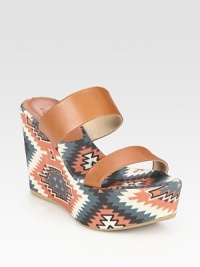 Rich leather slide with a trendy tribal-print linen footbed and wedge. Self-covered wedge, 4 (100mm)Covered platform, 1 (25mm)Compares to a 3 heel (75mm)Printed linen and leather upperLinen liningRubber solePadded insoleImportedOUR FIT MODEL RECOMMENDS ordering true size. Rich leather slide with a trendy tribal-print linen footbed and wedge. Self-covered wedge, 4 (100mm)Covered platform, 1 (25mm)Compares to a 3 heel (75mm)Printed linen and leather upperLinen liningRubber solePadded insoleImportedOUR FIT MODEL RECOMMENDS ordering true size.