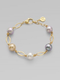 A gorgeous blend of different colored pearls with 18k goldplated sterling silver links. 10mm and 12mm round white, champagne, grey and black organic hand-made pearls 18k goldplated sterling silver Lobster clasp closure Length, about 7½ Imported 