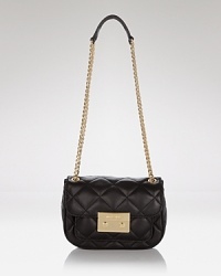 MICHAEL Michael Kors gives us a chic reason to downsize with this miniature leather shoulder bag. In quilted leather with gold tone trims, it encapsulates party-ready polish.