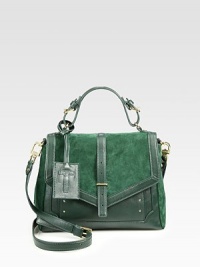 Luxuriously soft suede accented with buttery smooth leather in a chic satchel design with a versatile detachable strap.Adjustable leather top handle, 4-4½ dropDetachable adjustable leather shoulder strap, 21½-24½ dropSlide strap flap closureProtective metal feetOne outside zip pocketOne zip pocket under flapOne inside zip pocketTwo inside open pocketsOne detachable mirrorCanvas lining10½W X 9½H X 4¼DImported Luxuriously soft suede accented with buttery smooth leather in a chic satchel design with a versatile detachable strap.Adjustable leather top handle, 4-4½ dropDetachable adjustable leather shoulder strap, 21½-24½ dropSlide strap flap closureProtective metal feetOne outside zip pocketOne zip pocket under flapOne inside zip pocketTwo inside open pocketsOne detachable mirrorCanvas lining10½W X 9½H X 4¼DImported