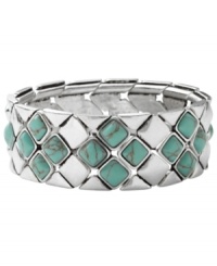 Infuse your look with the color of summer year round. Fossil's intricate diamond-patterned bracelet combines reconstituted semi-precious turquoise with silver tone mixed metal. Bracelet stretches to fit wrist. Approximate diameter: 2-1/2 inches. Infuse your look with the color of summer year round. Fossil's intricate diamond-patterned bracelet combines reconstituted semi-precious turquoise with silver tone mixed metal. Bracelet stretches to fit wrist. Approximate diameter: 2-1/2 inches.