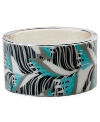 Infuse your look with the bold colors and exotic prints of Brasil. Crafted in silver tone mixed metal Haskell's Leaf bangle features blue and black leaf details and a hinge clasp. Approximate diameter: 2-1/2 inches. Approximate length: 8 inches. Item comes packaged in a turquoise gift box.