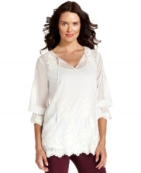 Embroidered floral embellishments adorn Alfani's pretty top, featuring a spin on the peasant silhouette with a scalloped hemline. Embroidered floral embellishments adorn Alfani's pretty top, featuring a spin on the peasant silhouette with a scalloped hemline.