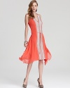 In a neon hue, BCBGMAXAZRIA's lace paneled dress lends a luxe look in silk chiffon.