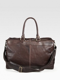 An ideal accessory for short trips or long weekend getaways, this weekender bag is remarkably crafted from luxurious, enzyme-washed leather lined with a striking coin print on the interior for subtle, signature accent.Zip closureDouble top handlesAdjustable shoulder strapInterior zip pocketCotton twill/leather liningLeather13W x 21H x 11DImported An ideal accessory for short trips or long weekend getaways, this weekender bag is remarkably crafted from luxurious, enzyme-washed leather lined with a striking coin print on the interior for subtle, signature accent.Zip closureDouble top handlesAdjustable shoulder strapInterior zip pocketCotton twill/leather liningLeather13W x 21H x 11DImported
