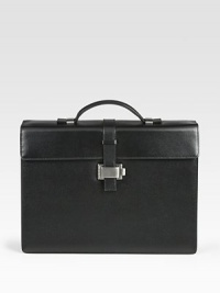 Single-gusset briefcase made of full-grain calfskin leather with a full, jacquard lining, ruthenium-plated metal accents and a unique lock closure.Top handleFlap front latch closureLeather14W x 10¼H x 4DMade in Italy Single-gusset briefcase made of full-grain calfskin leather with a full, jacquard lining, ruthenium-plated metal accents and a unique lock closure.Top handleFlap front latch closureLeather14W x 10¼H x 4DMade in Italy