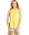 In a brightly bold shade, this RACHEL Rachel Roy twisted halter tank is perfect for dressing up denim!