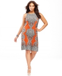 Cutaway shoulders add a flattering touch to INC's plus size dress. The paisley print and bold hue make it a standout piece for any wardrobe. Cutaway shoulders add a flattering touch to INC's plus size dress. The paisley print and bold hue make it a standout piece for any wardrobe.