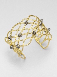 From the Elements Siyabona Collection. A stunning woven net pattern of textured goldtone, dotted with spikey clusters of dazzling Swarovski crystals.CrystalGoldtone and ruthenium platingDiameter, about 2.25 (adjustable)Width, about 1.5Imported From the Elements Siyabona Collection. A stunning woven net pattern of textured goldtone, dotted with spikey clusters of dazzling Swarovski crystals.CrystalGoldtone and ruthenium platingDiameter, about 2.25 (adjustable)Width, about 1.5Imported