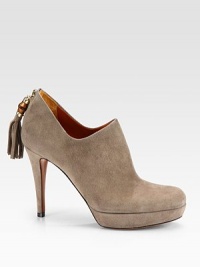 Suede ankle boots with bamboo and tassel details at the heel. Self-covered heel, 3½ (90mm) Platform, ¾ (20mm) Compares to a 2¾ heel (70mm) Shaft, 2 Bamboo tassel detail Back zip Leather lining and sole Padded insole Made in Italy 