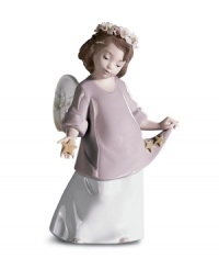 Counting her lucky stars, this darling angel gazes down from the heavens with a crown of flowers in delicately glazed Lladro porcelain. Counting her lucky stars, this darling angel gazes down from the heavens with a crown of flowers in delicately glazed Lladro porcelain.