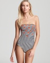 With its flirty print and bandeau silhouette, this MARC BY MARC JACOBS maillot is ready for hot sun and holidays. A crimson kisser and floppy straw hat complete the look.