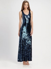 Dazzling by design, this slim, stretch dress, with alluring racerback, is covered with sequins, front and back.Scoop necklineSlim stretch fitRacerbackAbout 57½ from shoulder to hem95% nylon/5% spandexDry cleanImportedModel shown is 5'9½ (176cm) wearing US size Small. Dazzling by design, this slim, stretch dress, with alluring racerback, is covered with sequins, front and back.Scoop necklineSlim stretch fitRacerbackAbout 57½ from shoulder to hem95% nylon/5% spandexDry cleanImportedModel shown is 5'9½ (176cm) wearing US size Small.