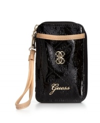 Take a shine to everyday accessorizing with this logo-embossed wristlet wallet from GUESS. Discretely stows phone, cards, cash and ID, while a glossy exterior lends instant polish.