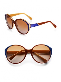 Oversized acetate frames with elegant, colorblocked detail and shiny metal trim accent these celeb-worthy shades. Available in brown/honey/blue and light gold metal with brown lens or smoke/cream and light gold metal with grey lens.Plastic temples100% UV protectionMade in Italy 