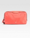 Glossy patent leather accents this durable nylon design.Top zip closureOne outside zip pocketCotton lining7½W X 4H X 2¾DImported