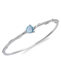 The perfect accent. Victoria Townsend's beautiful bangle features a trillion-cut blue topaz (3 ct. t.w.) and sparkling diamond accents. Set in sterling silver. Approximate length: 8 inches. The perfect accent. Victoria Townsend's beautiful bangle features a trillion-cut blue topaz (3 ct. t.w.) and sparkling diamond accents. Set in sterling silver. Approximate length: 8 inches.