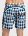 Quick-drying swim trunks, in a vivid check print, are accented by a lace-up waist and signature rainbow detail across the back and down the leg.Drawstring waistRear flap pocketInseam, about 7NylonMachine washImported