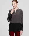 A whisper-light blouse enlivened by the color block trend for modern sophistication in pure silk.