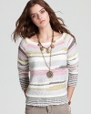 A sea of soft-colored stripes enliven this wool-blend Free People sweater that pairs perfectly with denim or cords this season.