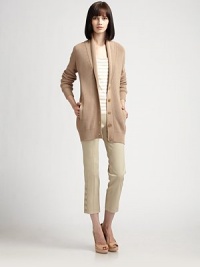Long v-neck cotton knit, with blazer-inspired lapel.Foldover lapelsButton frontRib-knit cuffs and hemSide slash pocketsAbout 29 from shoulder to hemCottonDry cleanMade in SwitzerlandModel shown is 5'9 (175cm) wearing US size 4. Long v-neck cotton knit, with blazer-inspired lapel.Foldover lapelsButton frontRib-knit cuffs and hemSide slash pocketsAbout 29 from shoulder to hemCottonDry cleanMade in SwitzerlandModel shown is 5'9 (175cm) wearing US size 4.