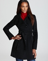Featuring the latest trend-a convertible collar-this modern DKNY trench coat puts a new spin on the classic silhouette. Wear it belted or not, either way it's a flawless layering for fall and beyond.