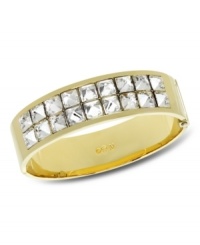 Golden opportunity. Sparkling studded crystals add edgy glamour to Swarovski's Newborn Bangle. Crafted in gold tone mixed metal, it's a unique update for your wardrobe. Approximate diameter: 2-1/4 inches. Golden opportunity. Sparkling studded crystals add edgy glamour to Swarovski's Newborn Bangle. Crafted in gold tone mixed metal, it's a unique update for your wardrobe. Approximate diameter: 2-1/4 inches.