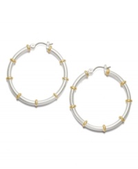 Traditional hoops with a fabulous two tone touch! From the Lauren by Ralph Lauren collection, medium-sized hoop earrings feature a silver tone mixed metal base with gold tone mixed metal accents and click closure. Approximate diameter: 1-1/4 inches.