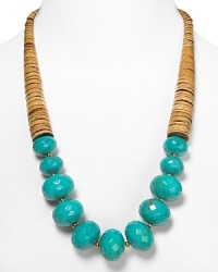 Tribal-inspired chic from RJ Graziano. This bold necklace marries graduated wooden discs with multifaceted turquoise beads for a versatile piece that works with a black dress or dark jeans. Tribal-inspired chic from RJ Graziano. This bold necklace marries graduated wooden discs with multifaceted turquoise beads for a versatile piece that works with a black dress or dark jeans.