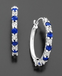 The perfect expression of elegance. Alternating round-cut sapphires (9/10 ct. t.w.) and diamond accents on 14k white gold hoop earrings. Diameter measures approximately 3/4 inch.