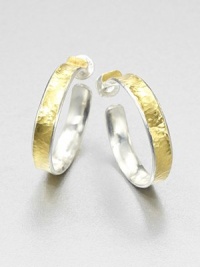A beautiful hoop design in sleek sterling silver and radiant 24k gold with a stunning hammered texture. Sterling silver24k goldPost backImported A beautiful hoop design in sleek sterling silver and radiant 24k gold with a stunning hammered texture. Sterling silver24k goldPost backImported